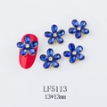 Macro shot of 13mm blue five-petal flower nail charms with gold metal base and rhinestones - 5113 Royal Blue
