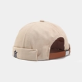 Detail view of beige canvas miki hat with blue helm embroidery and leather strap - Solid Beige Helm Embroidery