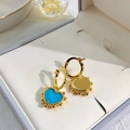 Close-up of gold heart earrings with blue inlay and bead edges in a gift box - Gold + Turquoise