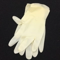 Close-up of disposable latex gloves for DIY resin crafting on a textured dark background - Yellow Latex Gloves (1 Pair)