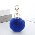 Detail of soft bright blue faux rabbit fur pompom keychain with golden metal clasp - Royal Blue