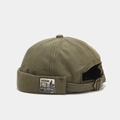 Detail of adjustable metal buckle and vintage side patch on military green docker hat - Adjustable / Standing Bear Olive Green