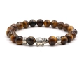 Detailed view of natural tiger eye beads with silver elephant charm and carved spacers - Tiger's Eye