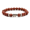 Detail of beaded bracelet with red goldstone beads and silver elephant charm - Gold Sandstone