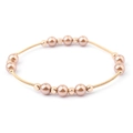 Macro detail of elastic champagne gold wire bracelet with metallic pearls and beads - Champagne Gold Wire with Champagne Pearls
