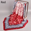 Detail view of red paisley print square silk scarf hanging to show texture and gloss - 90cm*90cm / Red