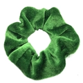 Green velvet scrunchie with soft pleated texture on white background for women - Green
