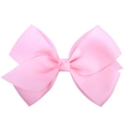 Detail of bright pink grosgrain ribbon bow hair clip with textured ribbed fabric texture - Bright Pink