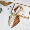 Polka dot silk scarf in brown and beige colors tied as a bow on a white background - Coffee Polka Dot