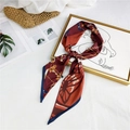 Red brown silk scarf with chain and carriage pattern tied in a bow on a frame - Blue Edge Belt Horse