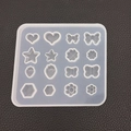 Translucent silicone DIY mold featuring 16 shapes like hearts, stars, and strawberries - Small Strawberry & Bow Mold