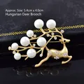 Golden reindeer brooch with white pearls and sparkling rhinestones, size 5.4cm x 4.0cm - No. 11-Gold Pearl Reindeer