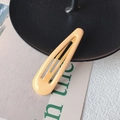 Minimalist light orange drop-shaped BB hair clip with a glossy metallic finish - Khaki