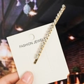 Golden bobby pin featuring sparkling crystals on a fashion jewelry display card - Rhinestone Clip / Gold