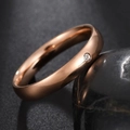 Detail of rose gold stainless steel ring with bezel set round cubic zirconia stone - US 9 / Rose Gold