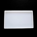 Vue macro d'un moule rectangulaire en silicone translucide sur une surface noire texturée - Nouveau Grand Rectangle 25x15cm (Épaissi)