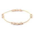 Detail of golden spring wire bracelet with beige wood beads and gold spacer beads - Gold Spiral Wire with Beige Flat Beads