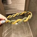 Detail of wave-braided yellow and green headband featuring internal anti-slip teeth grip - Yellow Green
