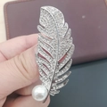 Silver feather brooch with sparkling crystals and a large white pearl accent - No. 36-Silver Rhinestone Feather Pearl