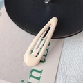 Classic cream beige teardrop-shaped metal hair clip with a smooth glossy finish - Off White