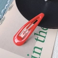 Minimalist red teardrop BB clip hair accessory with a smooth glossy finish for women - Red