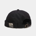 Detail of black canvas miki hat featuring retro denim labels and brass adjustable buckle - Adjustable / Standing Bear Black