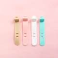 Silicone cable ties in khaki, pink, white, and mint green with adjustable buckle design - Set of 4 / Multicolor