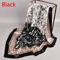 Close-up of black and brown paisley silk satin square scarf draped on a metal rack - 90cm*90cm / Black