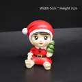Christmas Santa figurine holding a green tree ornament, size 5cm wide and 7cm high - Reindeer Baby Ornament