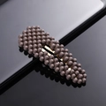Detailed view of a dark brown matte bead BB hair clip with a golden metal base - Coffee Brown Waterdrop