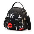 Waterproof black mini backpack for women featuring white graffiti and red lips print - Red Lips