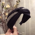 Cross knot black fabric headband with silver rhinestones and twisted crystal design - Black
