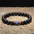 Matte black volcanic stone bracelet with coconut wood chips and blue stone bead accent - Black Matte Beads + Blue Variegated Bead + Wood (FD0180)
