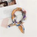 Detail of grey silk scarf featuring vintage belt patterns tied in a stylish knot - Belt Orange