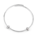 Close-up of adjustable silver bangle featuring two sliding beads and smooth metal texture - Adjustable Slide Style / Silver Bangle