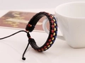 Bracciale in pelle intrecciata con strisce colorate e chiusura a cordoncino regolabile - Blu Giallo Rosso
