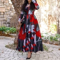 Women's floral maxi dress with long sleeves and pleated A-line skirt in outdoor setting - Red