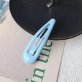 Classic light blue teardrop-shaped metal snap hair clip for women on a decorative base - Light Blue