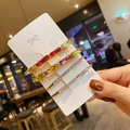 Close-up of gold chain hair clip set with multi-colored crystals on a white display card - Style F (4Pcs Geometry Colorful Diamond Set)