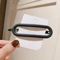 Minimalist navy blue oval acrylic hair clip with metal spring clip on display card - Large Oval / Navy Blue
