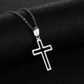 Detailed view of silver stainless steel cross pendant with black enamel inlay on a dark surface - Hollow Cross with Black Core / Steel