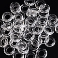 Faceted transparent crystal glass halo beads for nail art DIY on a black background - White