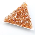 Iridescent orange glass ring beads with faceted finish in white triangle tray - Wine Red Plated
