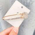 Golden tulip safety pin brooch with white rhinestones on jewelry card display - A7-35