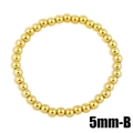 Detailed view of 5mm polished gold beaded elastic bracelet with high shine finish - 5mm / Gold