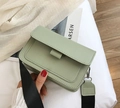 Sage green square crossbody bag with wide black fabric strap and leather finish - Light Green