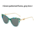 Cat eye sunglasses featuring green patterned frames, grey lenses, and gold butterfly temples - Green Stripe Frame Grey Lens