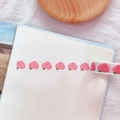 Pastel pink peach patterned washi tape applied on a blank notebook page for DIY - 1# Peach