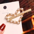 Detailed close-up of heart-shaped pearl hair clip on a white display card with gold metal base - Alloy Heart Pearl Duckbill Clip