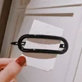 Glossy black oval cutout hair clip on card, Korean style minimalist hair accessory - Large Oval / Black